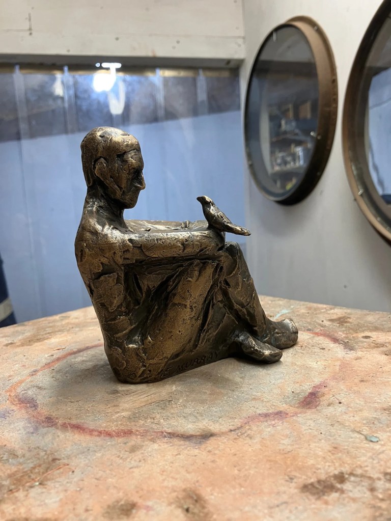 Seated Man and Bird